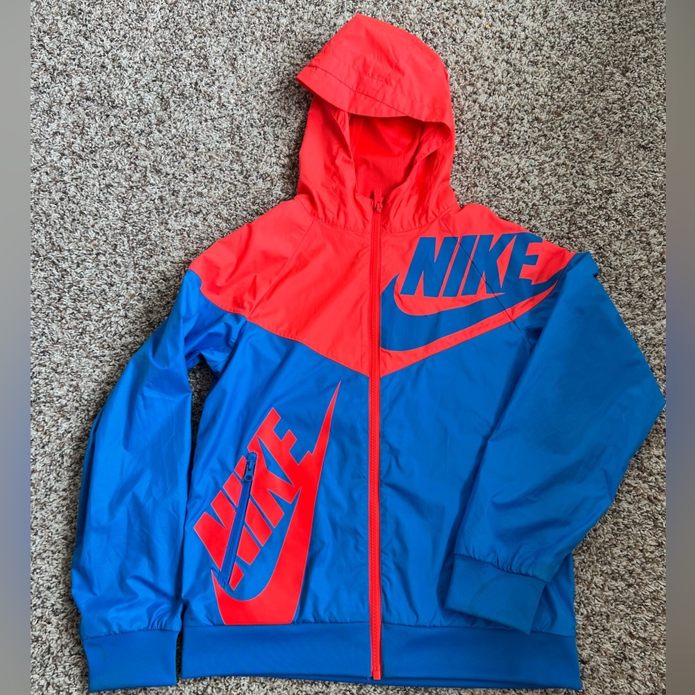 Big boys Nike light weight rain Jacket size Medium colors red and blue